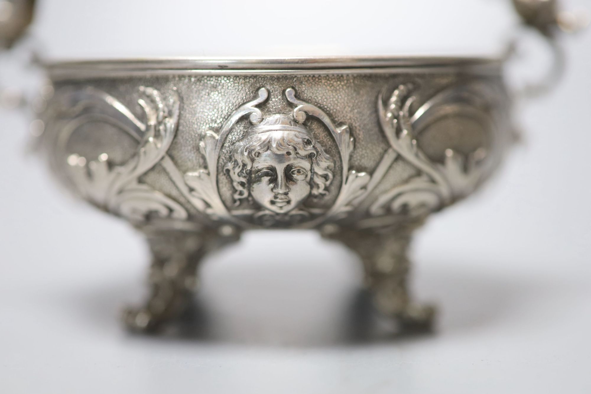 A pair of Italian white metal two handled sweetmeat bowls, by G Accarisi, with figural handles, dia. 85mm, 8oz.
